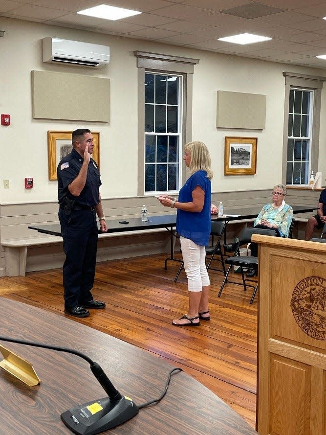 Dighton Assistant Town Clerk Pam Tenglin swears in Shawn Cronin in September of 2021 as a Dighton police lieutenant. In  August of 2022, Cronin was promoted to police chief.