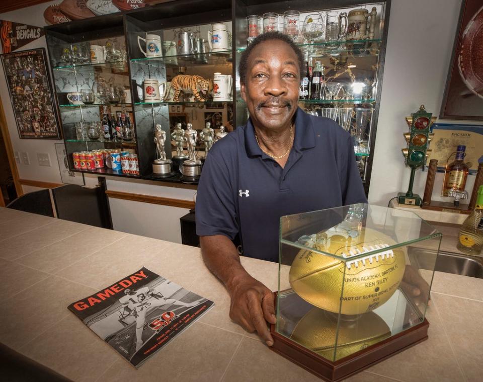 Ken Riley shows some of his career memorabilia at his home in Bartow, Florida, in July 2018.