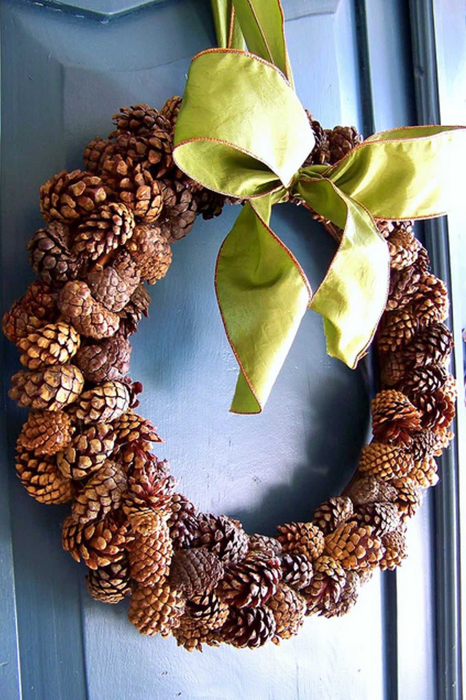 <p>Use cinnamon scented mini-pinecones available at craft stores to make this wreath. Guests will love being greeted with the smell of fall. </p><p><strong>Get the tutorial at <a href="http://www.hisugarplumsblog.com/2011/11/fall-diy-scented-pinecone-wreath.html" rel="nofollow noopener" target="_blank" data-ylk="slk:Hi Sugarplum;elm:context_link;itc:0;sec:content-canvas" class="link ">Hi Sugarplum</a>.</strong></p>