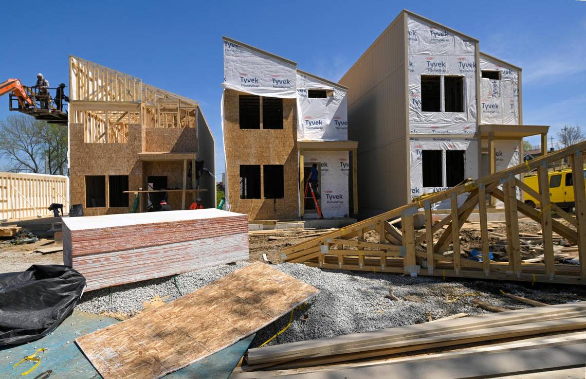 Three of seven new houses built by Lambie Homes, priced at about $494,000 each, rise on Mercier Street between 18th and 20th. Eight others, constructed by other home builders, are expected to go up within the year.