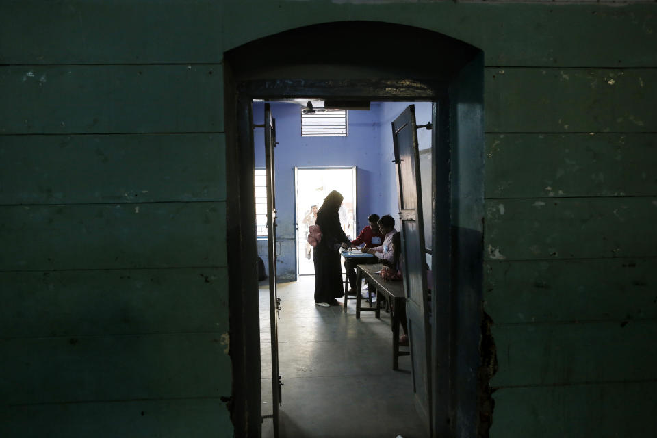 An Indian Muslim woman casts her vote at a polling station in Varanasi, India, Sunday, May 19, 2019. Indians are voting in the seventh and final phase of national elections, wrapping up a 6-week-long long, grueling campaign season with Prime Minister Narendra Modi’s Hindu nationalist party seeking reelection for another five years. Counting of votes is scheduled for May 23. (AP Photo/Rajesh Kumar Singh)