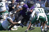 Northwestern running back Andrew Clair, center, (11) runs with the ball against Ohio defensive end Will Evans, left, and safety Tariq Drake (11) during the first half of an NCAA college football game in Evanston, Ill., Saturday, Sept. 25, 2021. (AP Photo/Nam Y. Huh)