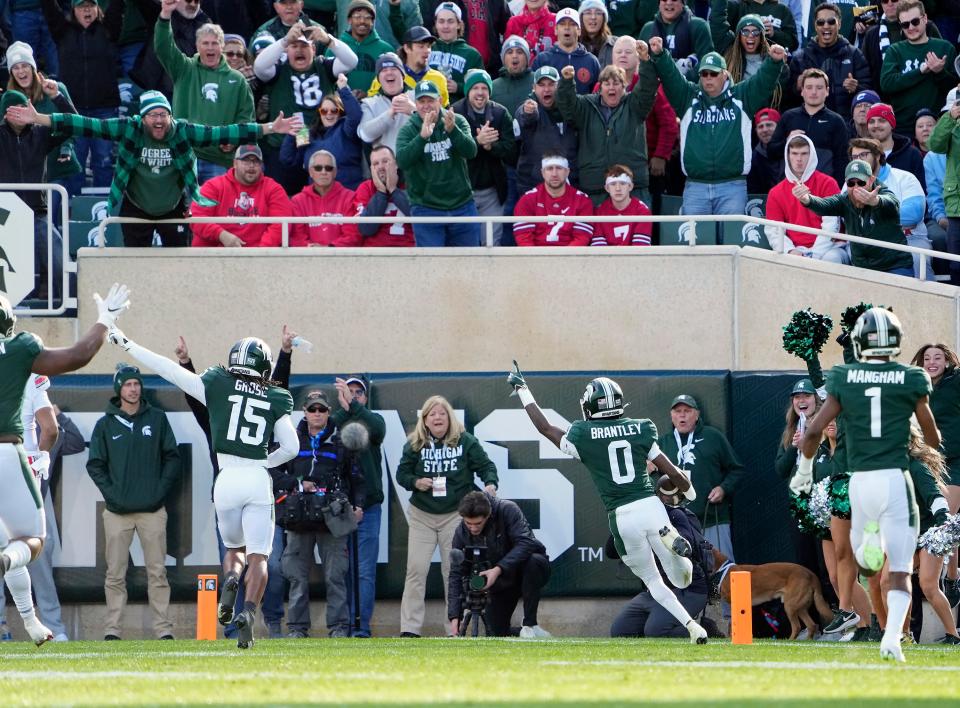 Michigan State Spartans cornerback Charles Brantley (0) returns an interception for a touchdown in the first quarter of the NCAA Division I football game between the Ohio State Buckeyes and Michigan State Spartans at Spartan Stadium on Oct. 8, 2022. Brantley played high school football at Venice High School.