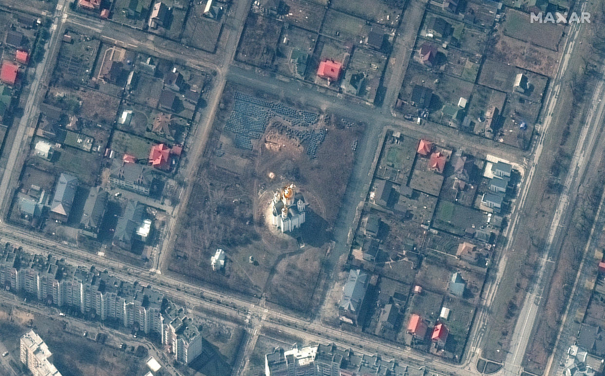 A mass grave identified in the town of Bucha, Ukraine, northwest of the capital of Kyiv. The grave site includes an approximately 45-foot-long trench in the southwestern section of the area near the church. (Maxar Technologies)