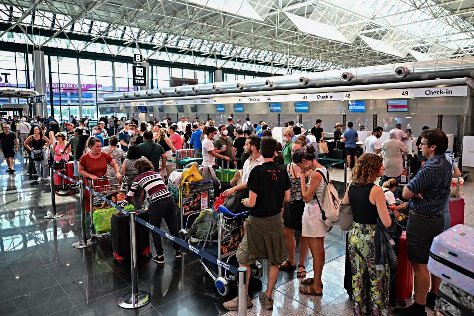 Passengers wait at Rome's Fiumicino airport during a strike by workers of some airline companies which forcibly cancelled hundreds of flights, in Rome, on July 17, 2022. (Photo by Andreas SOLARO / AFP) (Photo by ANDREAS SOLARO/AFP via Getty Images)