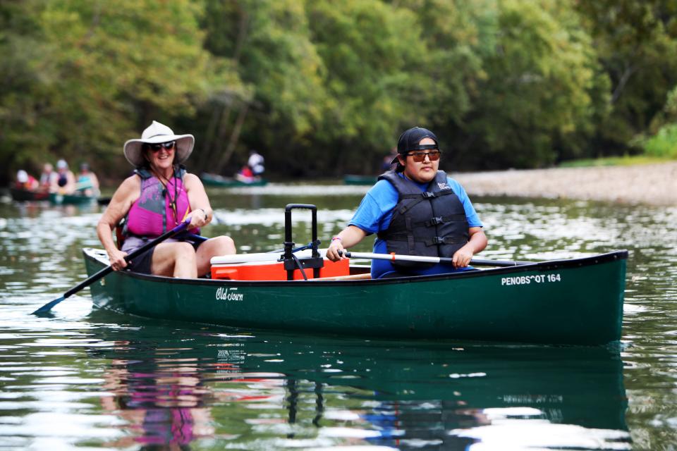 Volunteer Terri Bradley, left,  canoes with Ashley Guyer on the Niangua River for almost five miles Sept. 18, 2022.