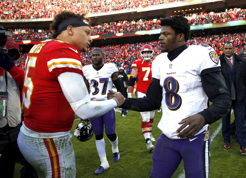 KANSAS CITY, MISSOURI - DECEMBER 09:  Quarterback Patrick Mahomes #15 of the Kansas City Chiefs shakes hands with quarterback Lamar Jackson #8 of the Baltimore Ravens after the Chiefs defeated the Ravens 27-24 in overtime to win the game at Arrowhead Stadium on December 09, 2018 in Kansas City, Missouri. (Photo by Jamie Squire/Getty Images)
