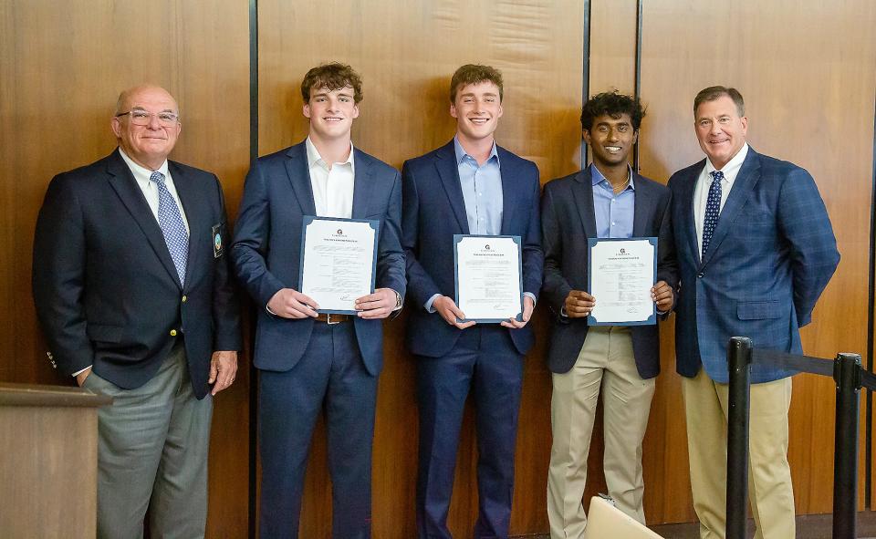 Three Gadsden City High School seniors — William Roberts, Everett Roberts and Nitin Nagarajan — were honored Feb. 21 at the Gadsden City Council meeting for earning National Merit Finalist recognition. They are flanked at left by council President Kent Back and at right by Mayor Craig Ford.