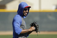 Texas Rangers' Elvis Andrus watches a drill during spring training baseball practice Monday, Feb. 17, 2020, in Surprise, Ariz. (AP Photo/Charlie Riedel)
