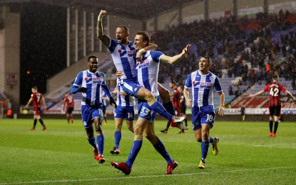 Dan Burn celebrates scoring Wigan's second goal - Action Images via Reuters