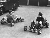 <p>Riding motorized go-karts with Prince Charles and Prince Edward.</p>