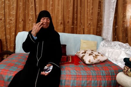 Chahla, 66, mother of Wahida, who was married to a militant killed in an air strike and is now being held with her son in a prison in Tripoli, reacts as she sits on her daughter's bed during a meeting with Reuters in El Kef, Tunisia June 1, 2016. REUTERS/Zohra Bensemra