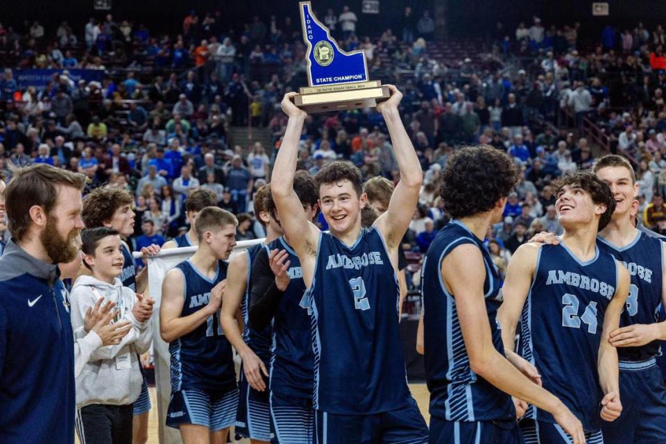 Ambrose senior Eli Sugarman holds the trophy after winning the 2A state championship win over Cole Valley Christian on March 2 at the Ford Idaho Center. 