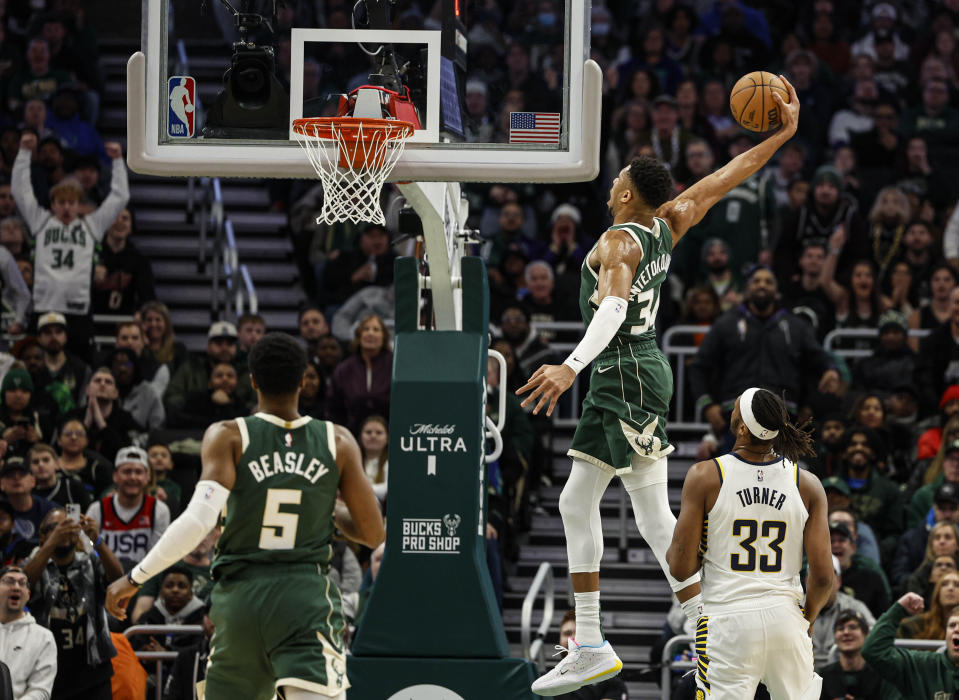 Milwaukee Bucks' Giannis Antetokounmpo (34) dunks against the Indiana Pacers during the first half of an NBA basketball game, Monday, Jan. 1, 2024, in Milwaukee. (AP Photo/Jeffrey Phelps)
