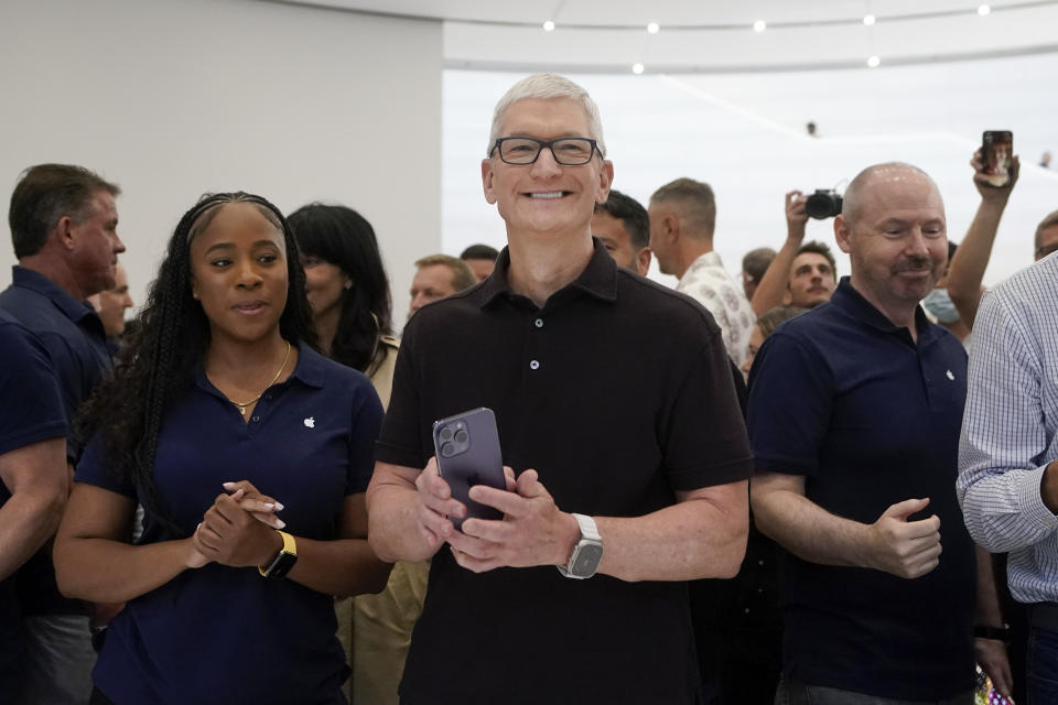 FILE - Apple CEO Tim Cook smiles at an Apple event in Cupertino, Calif., on Sept. 7, 2022. After ballooning for years, CEO pay growth is finally slowing. Cook, who was number three in the AP CEO pay survey, requested a 40% pay cut in 2023 after shareholders questioned the size and structure of his $99.4 million compensation package in 2022. (AP Photo/Jeff Chiu, File)