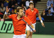 Daniel Nestor (front) and Milos Raonic, of Canada during a Davis Cup World Group first round doubles match in Vancouver on February 11, 2012. AFP PHOTO / Don MacKinnon (Photo credit should read Don MacKinnon/AFP/Getty Images)