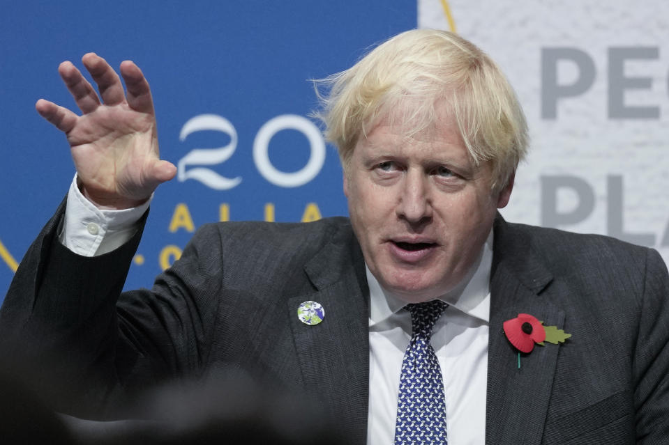 British Prime Minister Boris Johnson gestures as he speaks during a press conference at the La Nuvola conference center for the G20 summit in Rome, Sunday, Oct. 31, 2021. Leaders of the world's biggest economies made a compromise commitment Sunday to reach carbon neutrality "by or around mid-century" as they wrapped up a two-day summit that was laying the groundwork for the U.N. climate conference in Glasgow, Scotland. (AP Photo/Kirsty Wigglesworth)