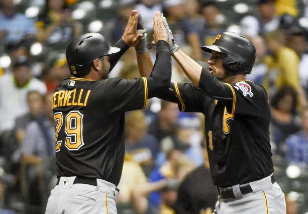 Francisco Cervelli (left) congratulates Jordy Mercer on his grand slam. (AP)