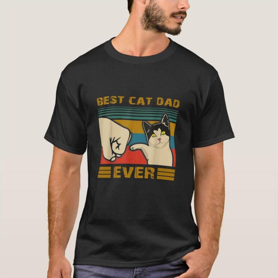 Man wearing a Best Cat Dad Ever Shirt on a gray background