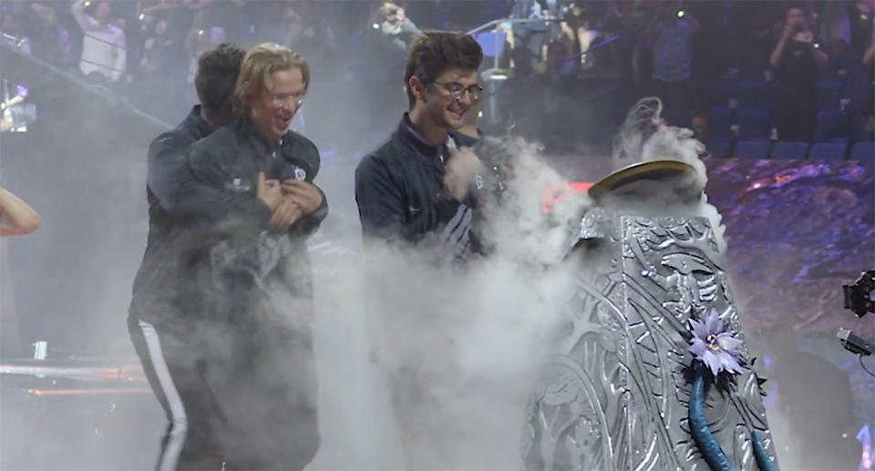 OG claiming the TI9 Aegis after their historic win at the Mercedes-Benz Arena in Shanghai, China.