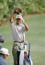 <p>U.S. Amateur Champion Tiger Woods takes off a tiger woo cover as he loosens up on the practice tee during practice round at the Masters in Augusta, Ga., April 5, 1995. (AP Photo/Curtis Compton) </p>