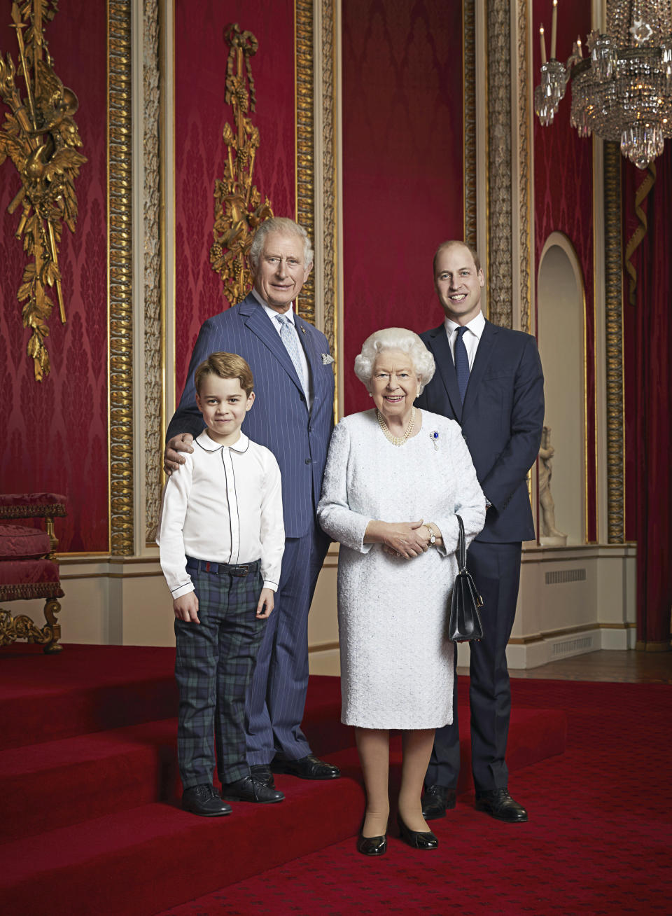 In this handout photo provided by Buckingham Palace and taken Wednesday Dec. 18, 2019, Britain's Queen Elizabeth, Prince Charles, Prince William and Prince George pose for a photo to mark the start of the new decade in the Throne Room of Buckingham Palace, London. This is only the second time such a portrait of the monarch and the next three in line to the throne has been released, the first was in April 2016 to celebrate Her Majesty's 90th birthday. (Ranald Mackechnie/Buckingham Palace via AP)