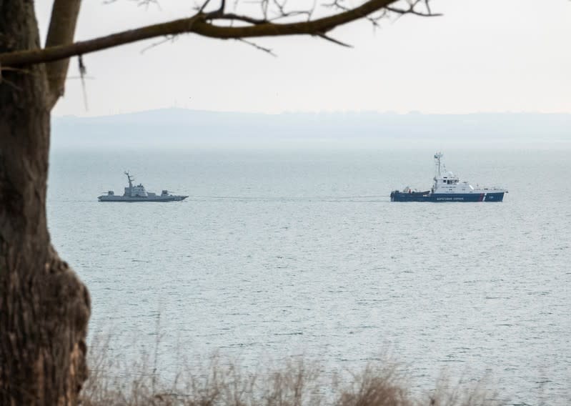 Seized Ukrainian naval ships are towed by Russia's Coast Guard vessels out of the port in Kerch