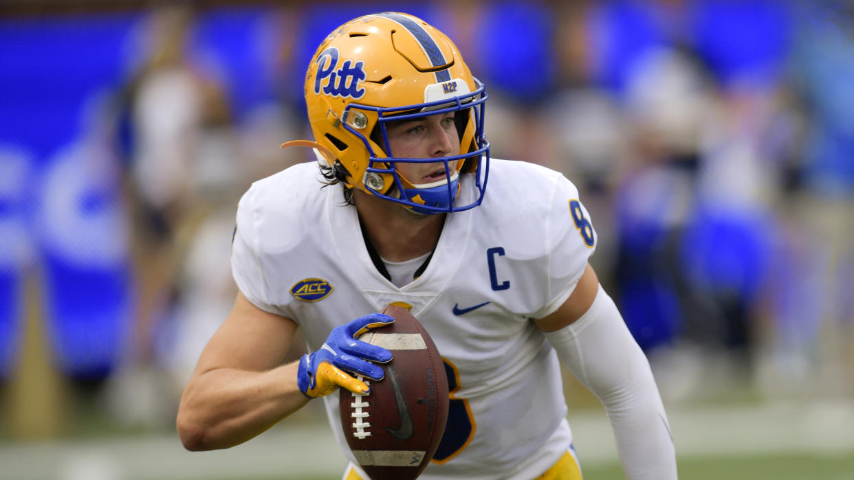 Pittsburgh quarterback Kenny Pickett (8) runs out of the pocket against Georgia Tech during the first half of an NCAA college football game, Saturday, Oct. 2, 2021, in Atlanta. (AP Photo/Mike Stewart)