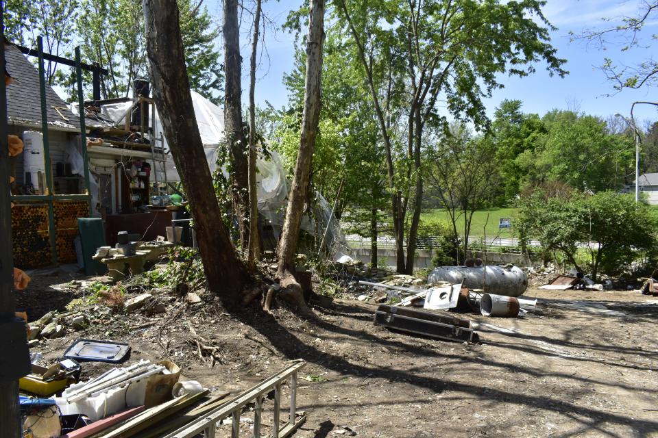 Robert Lowers has been clearing items from his Ellettsville property, including the back yard, to comply with town ordinances.