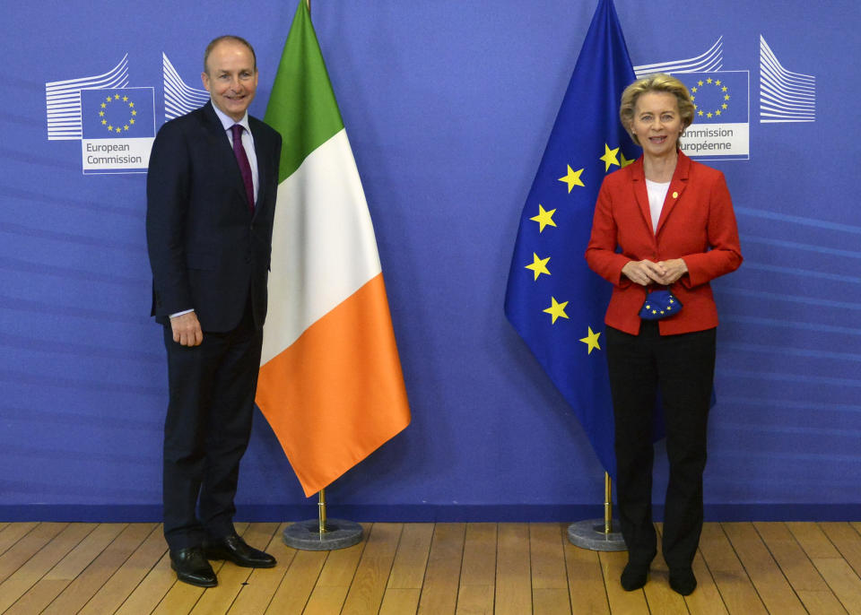 European Commission President Ursula von der Leyen, right, poses for a photographer with Ireland's Prime Minister Micheal Martin prior to a meeting at EU headquarters in Brussels, Thursday, Oct. 1, 2020. (Johanna Geron, Pool via AP)