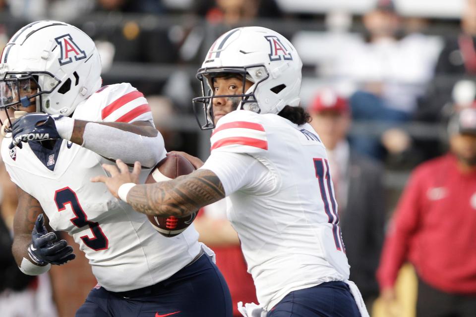 Arizona quarterback Noah Fifita (11) looks for a receiver during the first half of the team's NCAA college football game against Washington State on Oct. 14, 2023, in Pullman, Wash.