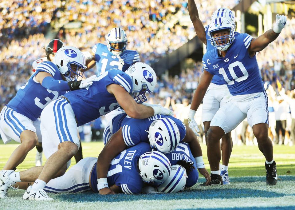 Brigham Young Cougars cornerback Eddie Heckard (5) recovers a fumble for a touchdown against the Texas Tech Red Raiders in Provo on Saturday, Oct. 21, 2023. BYU won 27-14.