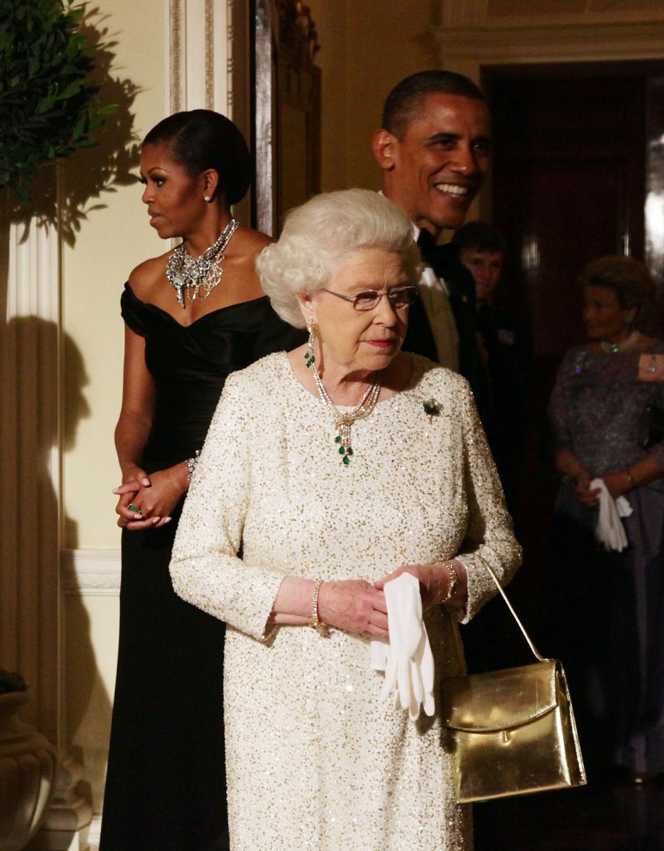 Queen Elizabeth II wears a brooch given to her by President Barack Obama and First Lady Michelle Obama during a 2011 visit to England.