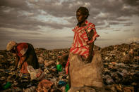 <b>First Place for People: Amongst the Scavengers</b> <br> At the end of the day women are allowed to pick through the dumpsite. <a href="http://ngm.nationalgeographic.com/ngm/photo-contest/" rel="nofollow noopener" target="_blank" data-ylk="slk:(Photo and caption by Micah Albert/National Geographic Photo Contest);elm:context_link;itc:0;sec:content-canvas" class="link ">(Photo and caption by Micah Albert/National Geographic Photo Contest)</a>