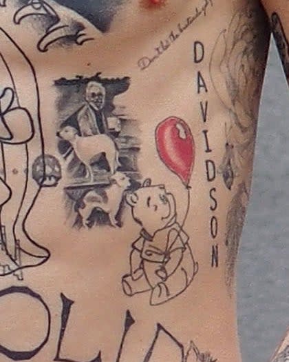 A closeup of the tattoos described