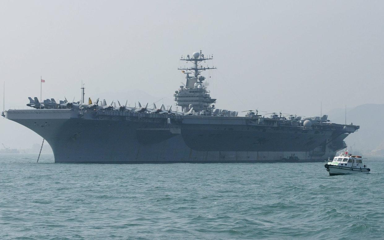 John Bolton said the deployment of the USS Abraham Lincoln Carrier Strike Group and a bomber task force was in response to 'troubling and escalatory indications' - AFP