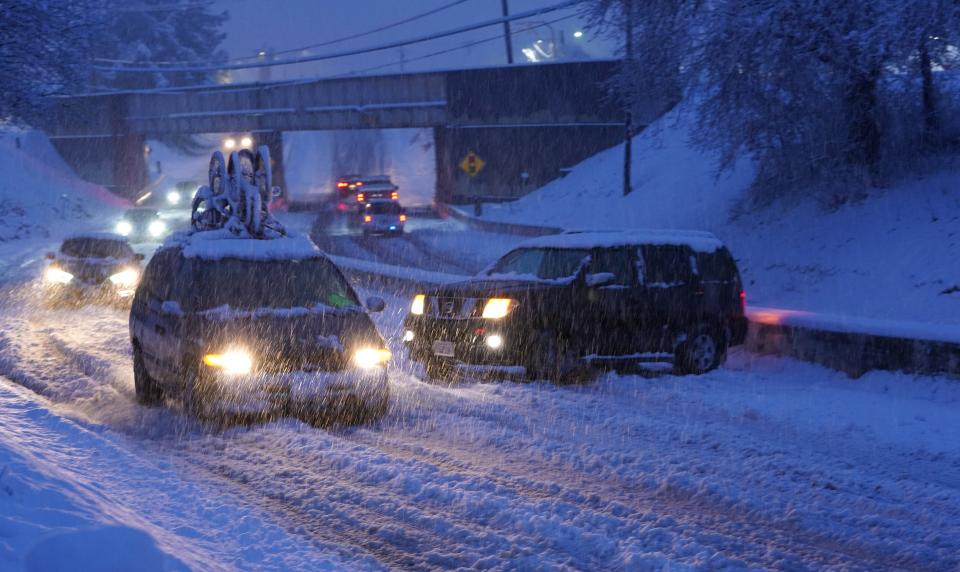 Traffic pass by an SUV that spun out in the snow on the southbound lane of Highway 273 near Buenaventura Buenaventura Boulevard. on Friday, Feb. 24, 2023..