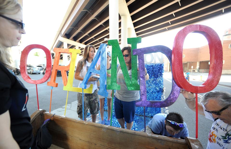 Before the 2016 Knoxville PrideFest Parade on June 18, 2016, Metropolitan Community Church members memorialize the deadly June 12 Pulse nightclub mass shooting in Orlando that killed 49 people.