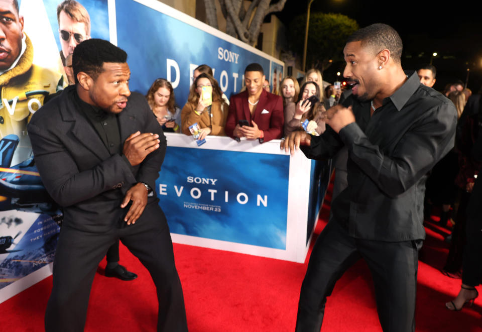 Los Angeles, CA - November 15, 2022: Jonathan Majors and Michael B. Jordan at the Premiere of Columbia Pictures’ DEVOTION at the Regency Village Theatre in Westwood.
