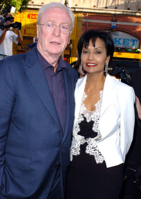 Premiere: Michael Caine with wife Shakira at the Hollywood premiere of Warner Bros. Pictures' Batman Begins - 6/6/2005 Photo: Steve Granitz, WireImage.com