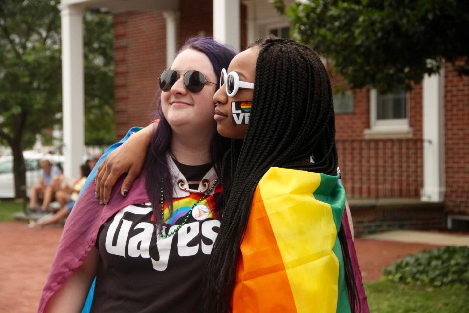 Hailey Foster, left, of Dover and Geena Handy of Camden celebrate Delaware's first Pride Parade in downtown Dover on June 1, 2019.
