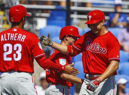 Feb 28, 2019; Dunedin, FL, USA; Philadelphia Phillies right fielder Dylan Cozens (25) celebrates with Philadelphia Phillies left fielder Aaron Altherr (23) after hitting a three run homer during the first inning of a spring training baseball game against the Toronto Blue Jays at Dunedin Stadium. Mandatory Credit: Butch Dill-USA TODAY Sports