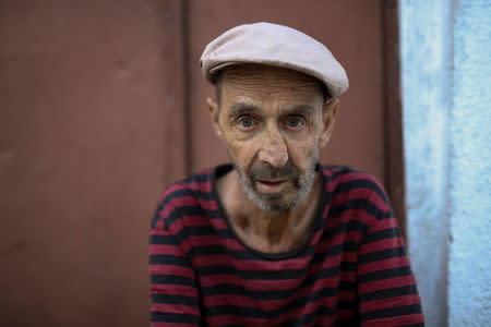 Muharem, who was never employed as he owns two properties which he rents, poses for a portrait in an old part of Skopje called Stara Carsija, Macedonia, May 31, 2018. "It is on politicians to make a deal about the name, not on people. Salaries here are about two hundred euro per month and I don't think this will change if we join NATO. Greeks have to return properties in northern Greece which they took from Macedonians in the past, after that I hope we can make a deal," Muharem said. REUTERS/Marko Djurica