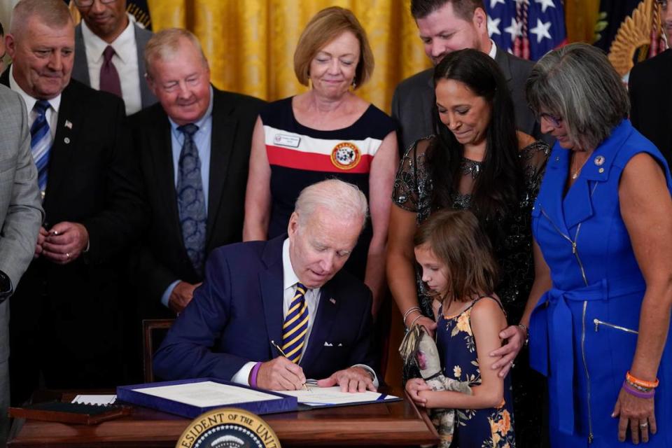 President Joe Biden signs the “PACT Act of 2022” during a ceremony in the East Room of the White House, Wednesday, Aug. 10, 2022, in Washington. (AP Photo/Evan Vucci)