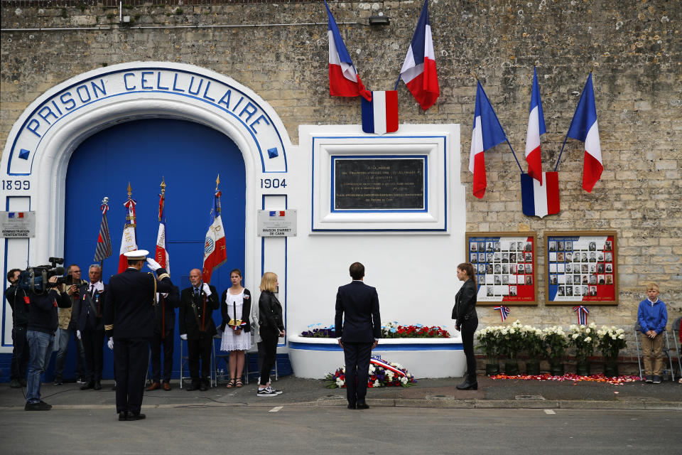 French president Emmanuel Macron attends a ceremony at the Caen prison to pay tribute to French resistants as part of D-Day ceremonies in Caen, Wednesday, June 5, 2019. On June 5, 1944, the Germans have shot 80-85 persons at the prison of Caen, including 71 who have been identified, members of Resistance. (AP Photo/Francois Mori, pool)