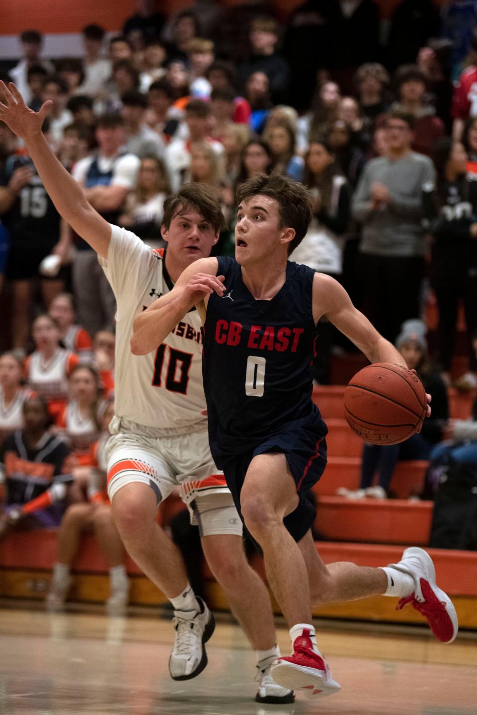 Pennsbury junior Connor Taddei chases CB East senior Joey Giordano at Pennsbury High School on Thursday, Jan. 12, 2023. CB East boys basketball defeated Pennsbury in a buzzer beater, 52-51.