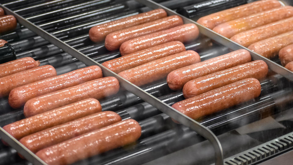 hot dogs on a rolling grill