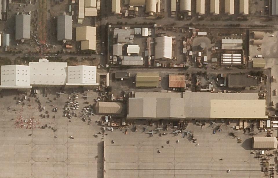 In this satellite photo taken by Planet Labs Inc., abandoned and disabled vehicles and aircraft are seen at Kabul's international airport after the U.S. withdrawal from Afghanistan on Aug. 31, 2021.