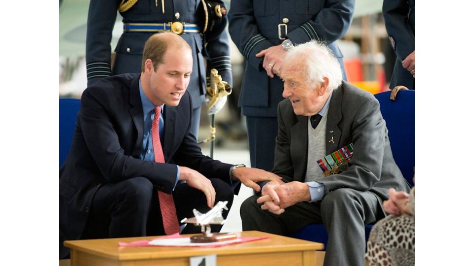 Prince William, Honorary Air Commandant of Royal Air Force Coningsby, chats to Battle of Britain Spitfire pilot Squardon Leader Tony Pickering during a visit to the RAF station 