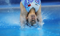 Shi Tingmao of China competes in women's diving 3m springboard preliminary at the Tokyo Aquatics Centre at the 2020 Summer Olympics, Friday, July 30, 2021, in Tokyo, Japan. (AP Photo/Dmitri Lovetsky)